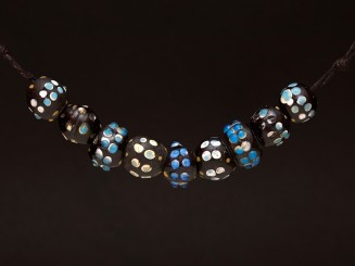 9 Venetian trade beads...